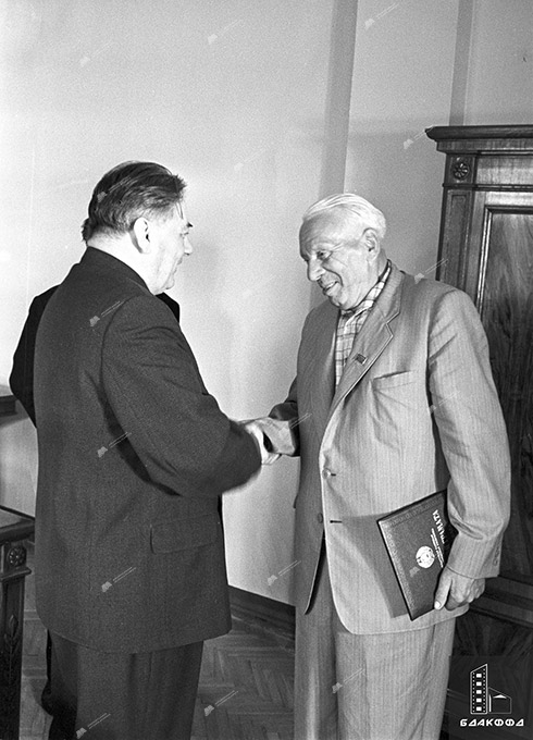 Chairman of the Presidium of the Supreme Council of the BSSR V.I.Kozlov presents M.T.Lynkov with a Certificate of Honor from the Supreme Council of the BSSR and a certificate awarding him the honorary title of People’s Writer of the Byelorussian SSR. July 3, 1962, Minsk. BelTA photo chronicle, L.Papkovich-с. 0